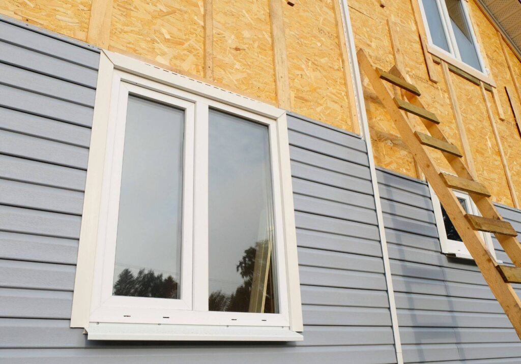 Siding Covering The Wall Of A House Under Construction Landscape A69441fe485cd961b09daf01a2e7564d W3kql4dvj1sf
