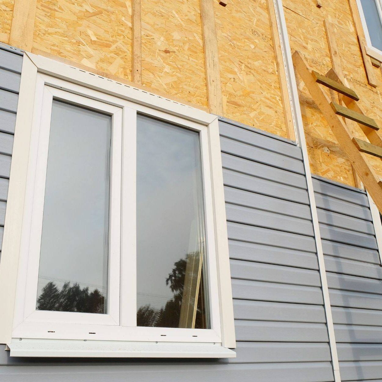 Siding Covering The Wall Of A House Under Construction Landscape A69441fe485cd961b09daf01a2e7564d W3kql4dvj1sf